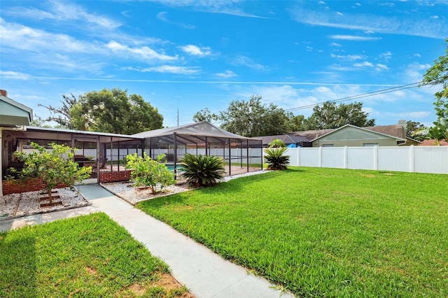 2013 Capri Rd, Valrico, FL 33594 - view of yard featuring glass enclosure and a patio