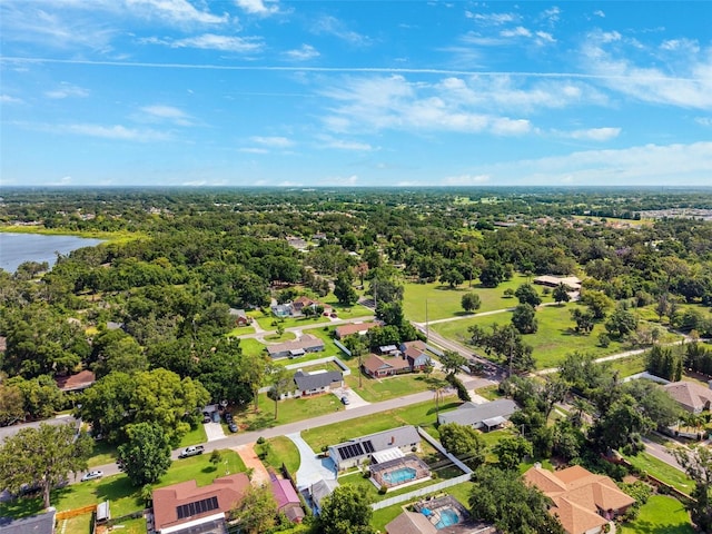 2013 Capri Rd, Valrico, FL 33594 - aerial view of residential area featuring a large body of water and a heavily wooded area