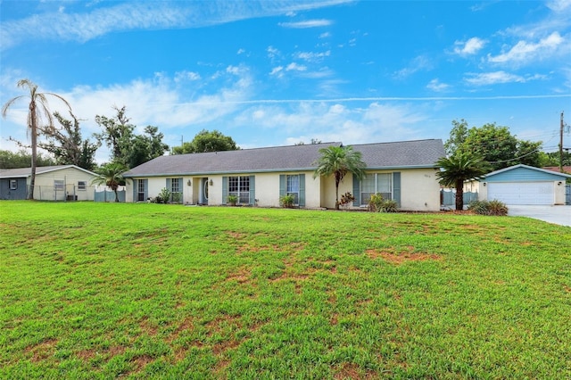 2013 Capri Rd, Valrico, FL 33594 - ranch-style house featuring a front yard, concrete driveway, and a detached garage