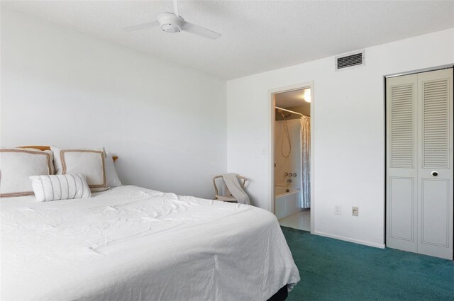 801 83rd Ave N Unit 209, Saint Petersburg, FL 33702 - bedroom with carpet, ensuite bathroom, a closet, and a ceiling fan