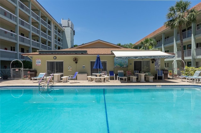 801 83rd Ave N Unit 209, Saint Petersburg, FL 33702 - community pool featuring a patio, fence, and central AC