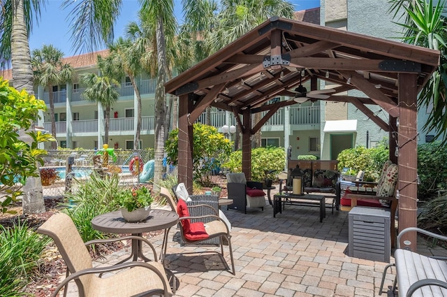 801 83rd Ave N Unit 209, Saint Petersburg, FL 33702 - view of patio featuring a gazebo and ceiling fan