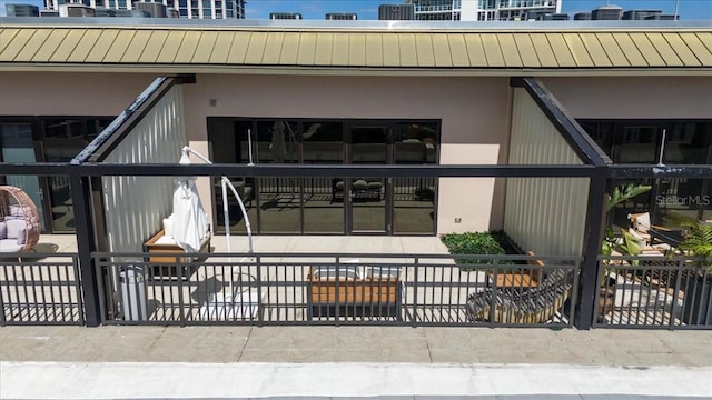 175 S 2nd St S Ph-16, Saint Petersburg, FL 33701 - property entrance featuring a standing seam roof, metal roof, and stucco siding