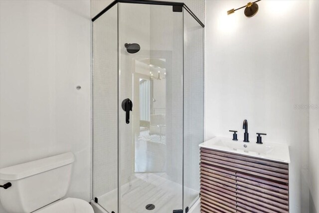 175 S 2nd St S Ph-16, Saint Petersburg, FL 33701 - bathroom with a sink, a stall shower, and toilet