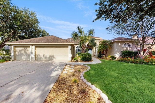 9408 Sayre St, Riverview, FL 33569 - view of front of home featuring concrete driveway, an attached garage, stucco siding, and a front lawn