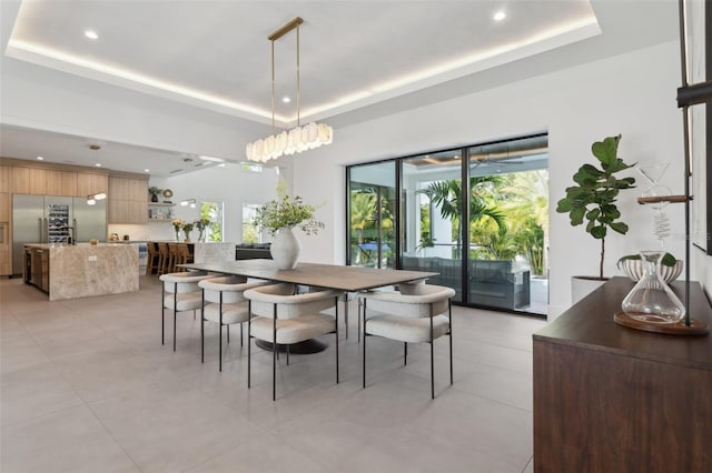 2902 S Beach Dr, Tampa, FL 33629 - dining area with a raised ceiling, light tile patterned floors, and recessed lighting