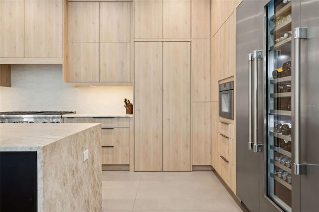 2902 S Beach Dr, Tampa, FL 33629 - kitchen featuring high end refrigerator, light brown cabinetry, modern cabinets, and light stone counters