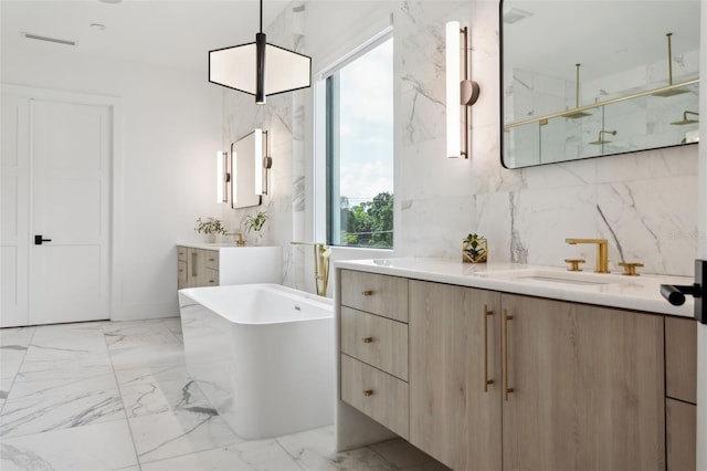 2902 S Beach Dr, Tampa, FL 33629 - full bath with a marble finish shower, a freestanding tub, marble finish floors, and two vanities