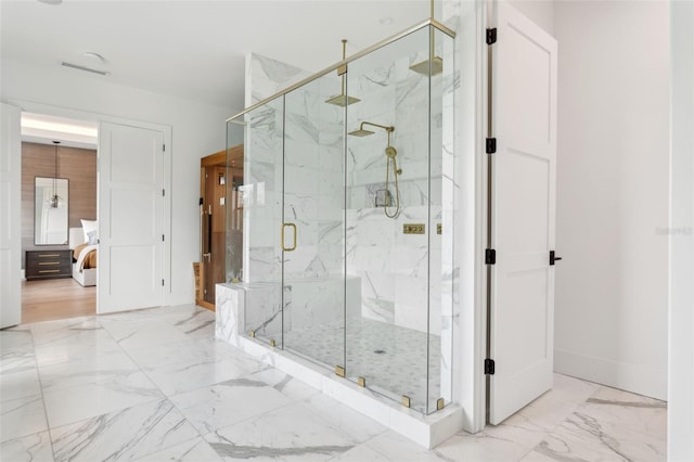 2902 S Beach Dr, Tampa, FL 33629 - bathroom with marble finish flooring, a marble finish shower, ensuite bathroom, and baseboards