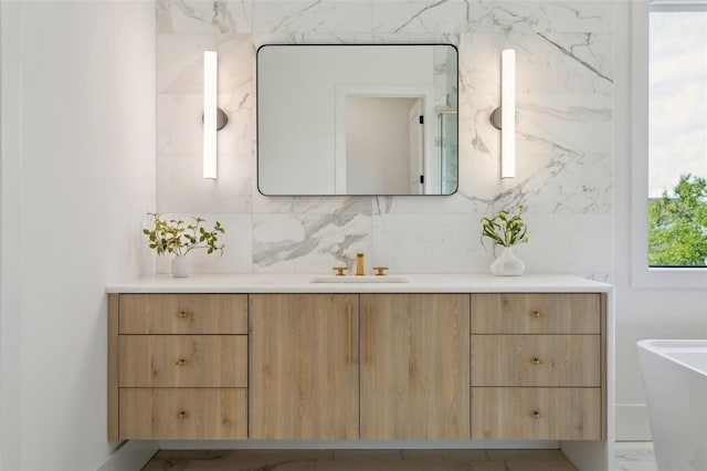 2902 S Beach Dr, Tampa, FL 33629 - full bath with vanity, a freestanding tub, and decorative backsplash