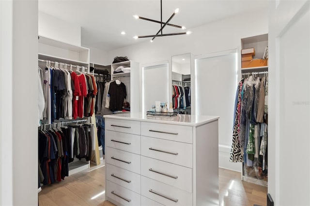 2902 S Beach Dr, Tampa, FL 33629 - walk in closet with light wood-type flooring and a chandelier