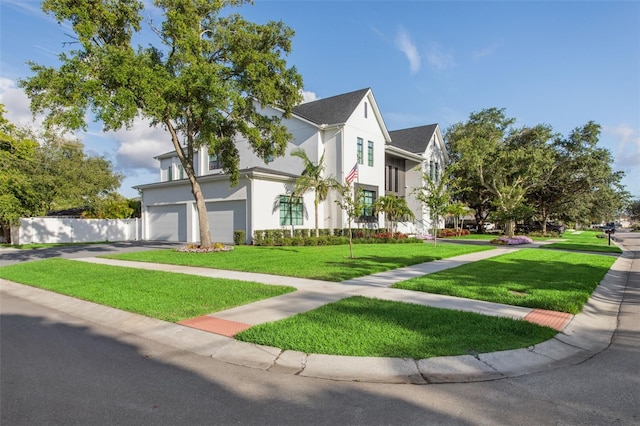 2902 S Beach Dr, Tampa, FL 33629 - view of front of property with an attached garage, a front lawn, stucco siding, and driveway