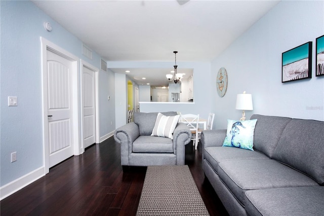 399 2nd St Unit 417, Indian Rocks Beach, FL 33785 - living room with wood-type flooring, a chandelier, and baseboards