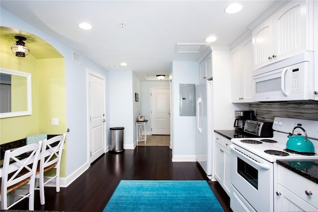 399 2nd St Unit 417, Indian Rocks Beach, FL 33785 - kitchen featuring white appliances, dark countertops, baseboards, and recessed lighting