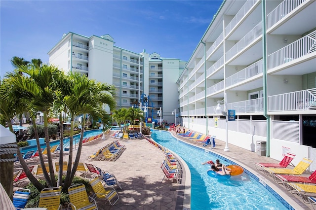 399 2nd St Unit 417, Indian Rocks Beach, FL 33785 - community pool featuring cooling unit and a patio
