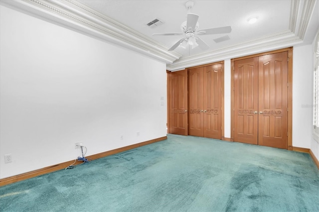 8827 Scout Lake Ct, New Port Richey, FL 34654 - unfurnished bedroom with carpet floors, two closets, baseboards, a ceiling fan, and crown molding