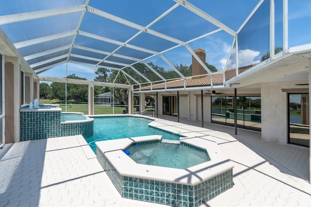 8827 Scout Lake Ct, New Port Richey, FL 34654 - view of swimming pool featuring a pool with connected hot tub, ceiling fan, a patio, and a lanai
