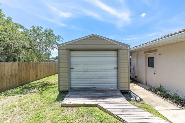 8827 Scout Lake Ct, New Port Richey, FL 34654 - garage featuring a storage unit