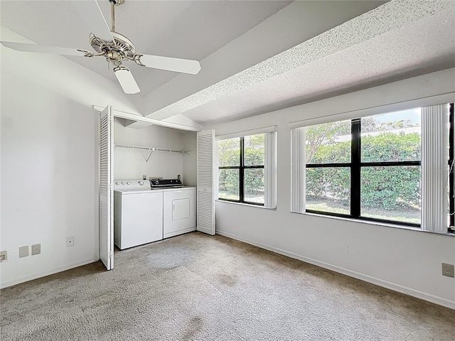 1556 Lynda Ln, Dunedin, FL 34698 - laundry area featuring washer and clothes dryer, light colored carpet, a ceiling fan, and baseboards