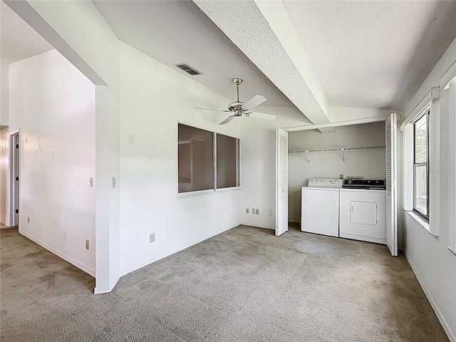1556 Lynda Ln, Dunedin, FL 34698 - laundry area with washing machine and clothes dryer, carpet, a ceiling fan, a textured ceiling, and baseboards