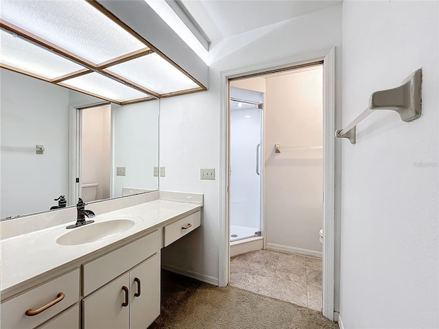 1556 Lynda Ln, Dunedin, FL 34698 - bathroom featuring toilet, a stall shower, vanity, and baseboards