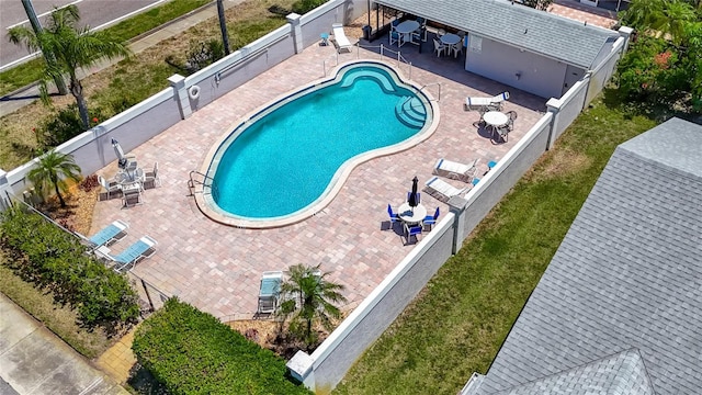 1556 Lynda Ln, Dunedin, FL 34698 - community pool featuring a fenced backyard and a patio