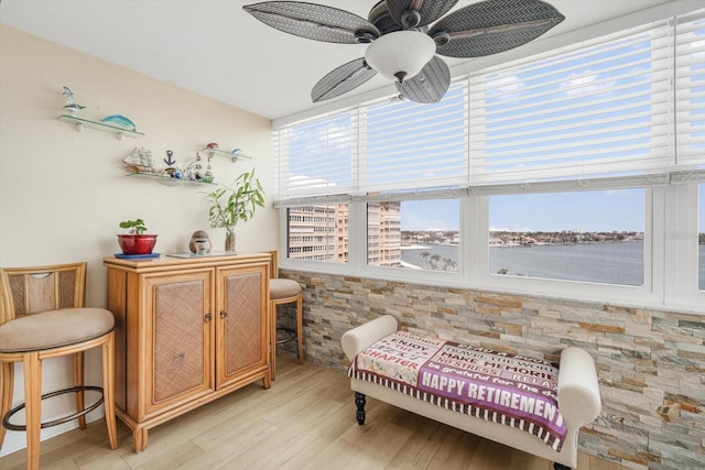 5130 Brittany Dr S Unit 604, Saint Petersburg, FL 33715 - sitting room with light wood finished floors and ceiling fan