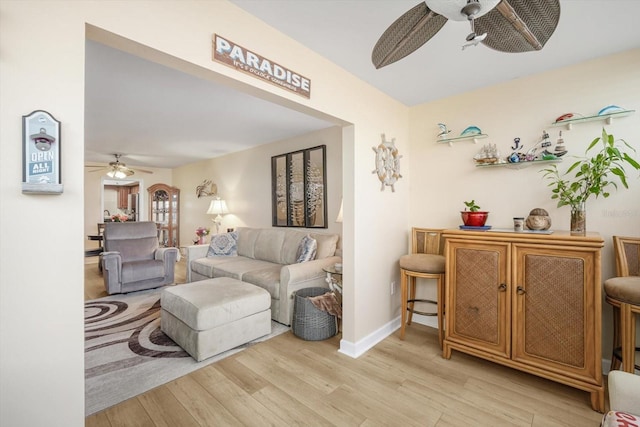 5130 Brittany Dr S Unit 604, Saint Petersburg, FL 33715 - living room featuring a ceiling fan and light wood-style floors