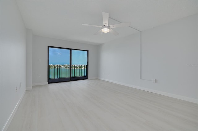 7050 Sunset Dr S Unit 1401, South Pasadena, FL 33707 - empty room featuring light wood-type flooring, baseboards, and ceiling fan