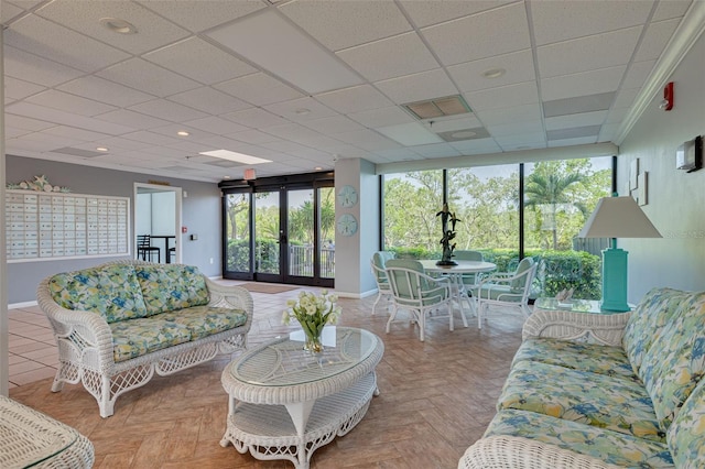 7050 Sunset Dr S Unit 1401, South Pasadena, FL 33707 - living room featuring baseboards and a paneled ceiling