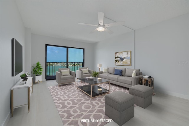 7050 Sunset Dr S Unit 1401, South Pasadena, FL 33707 - living area with ceiling fan, baseboards, and wood finished floors