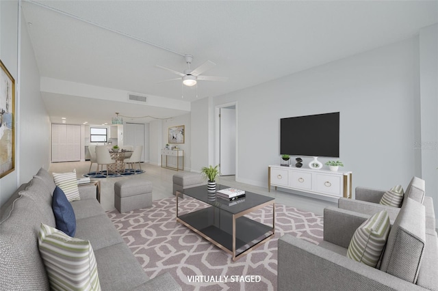 7050 Sunset Dr S Unit 1401, South Pasadena, FL 33707 - carpeted living room featuring a ceiling fan