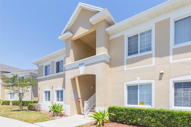 9524 Newdale Way Unit 101, Riverview, FL 33578 - view of front facade featuring stucco siding