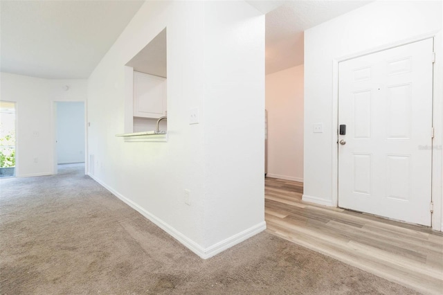 9524 Newdale Way Unit 101, Riverview, FL 33578 - hallway featuring carpet and baseboards