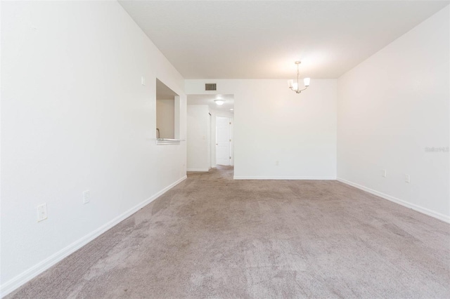 9524 Newdale Way Unit 101, Riverview, FL 33578 - empty room featuring carpet flooring, baseboards, and a chandelier