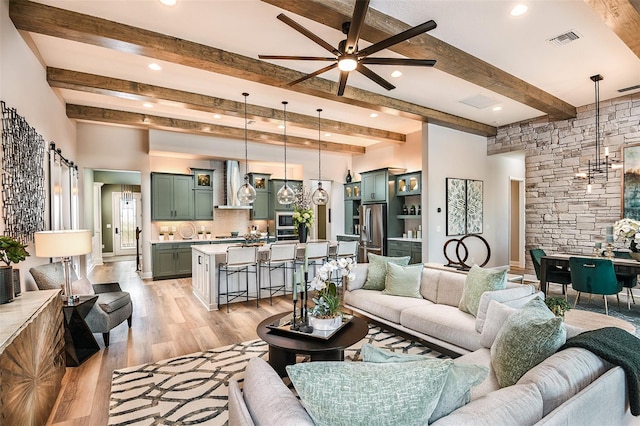 13726 Heartwood Way, Parrish, FL 34219 - living area featuring a ceiling fan, beam ceiling, light wood-style flooring, and recessed lighting