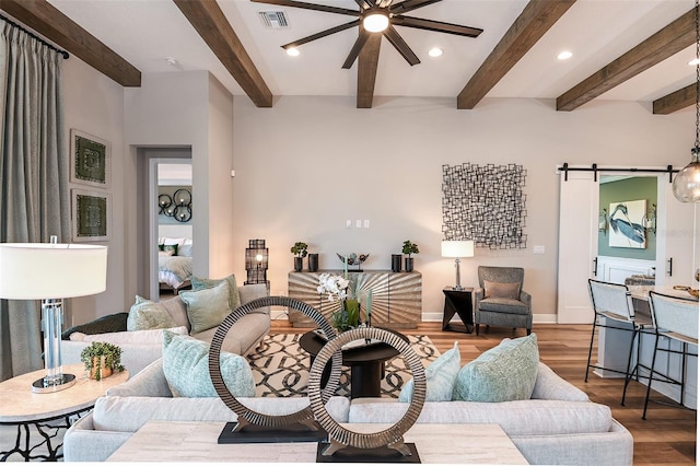 13726 Heartwood Way, Parrish, FL 34219 - living room featuring ceiling fan, wood finished floors, a barn door, recessed lighting, and baseboards