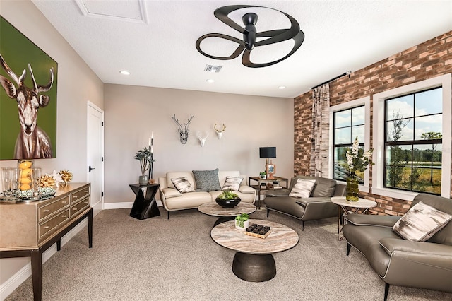 13726 Heartwood Way, Parrish, FL 34219 - living room with ceiling fan, carpet, brick wall, baseboards, and a textured ceiling