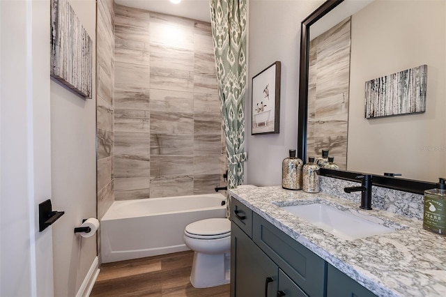 13726 Heartwood Way, Parrish, FL 34219 - full bathroom with wood finished floors, toilet, vanity, and  shower combination