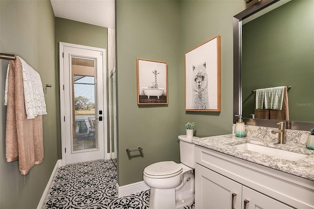 13726 Heartwood Way, Parrish, FL 34219 - bathroom featuring baseboards, vanity, and toilet