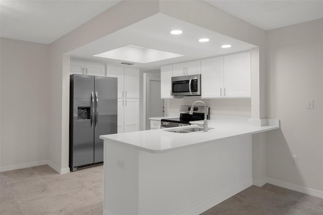 4315 Flexer Dr, Hernando Beach, FL 34607 - kitchen with stainless steel appliances, a sink, light countertops, recessed lighting, and white cabinetry