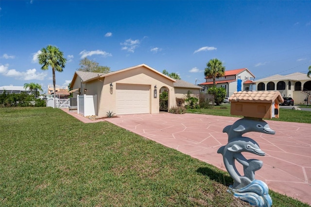 4315 Flexer Dr, Hernando Beach, FL 34607 - view of front of property with an attached garage, stucco siding, concrete driveway, and a gate