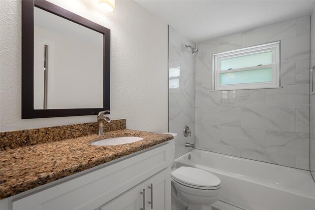 4315 Flexer Dr, Hernando Beach, FL 34607 - full bathroom featuring vanity, toilet, shower / washtub combination, and a textured wall