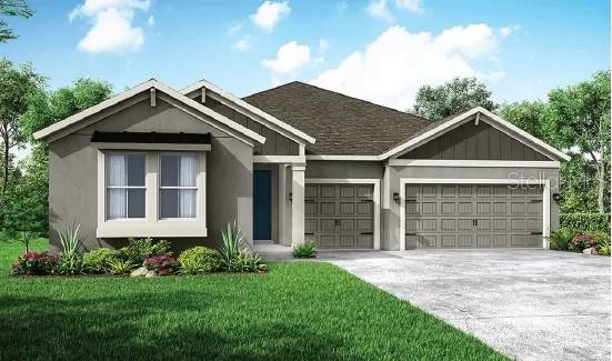 15725 Rosebud Ct, Punta Gorda, FL 33982 - view of front facade featuring an attached garage, driveway, a front yard, and stucco siding