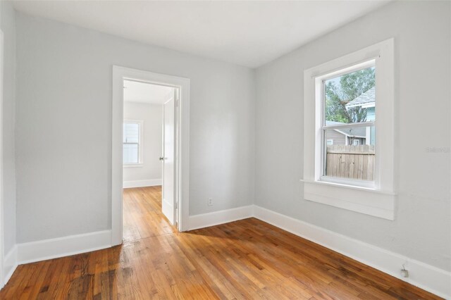 2015 3rd St S, Saint Petersburg, FL 33705 - unfurnished room with wood-type flooring and baseboards