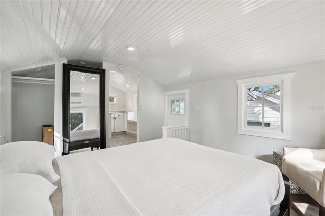 2015 3rd St S, Saint Petersburg, FL 33705 - bedroom with lofted ceiling, a closet, and ensuite bath