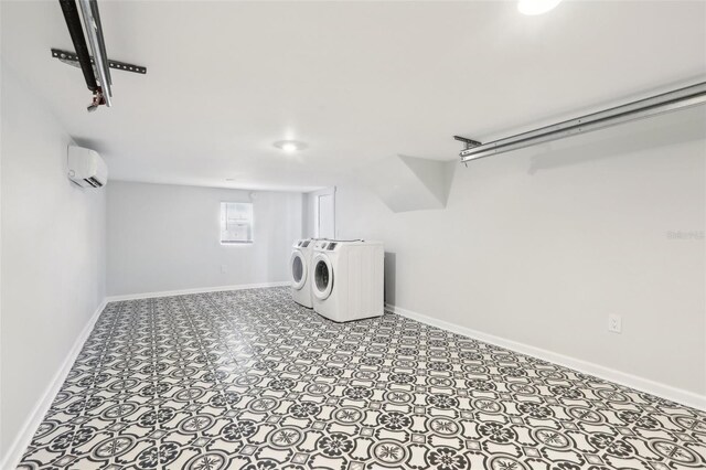 2015 3rd St S, Saint Petersburg, FL 33705 - laundry area featuring washing machine and dryer, a wall unit AC, and baseboards