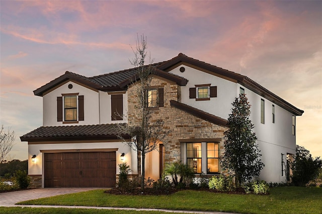 13722 Heartwood Way, Parrish, FL 34219 - mediterranean / spanish house featuring stone siding, stucco siding, and a tile roof