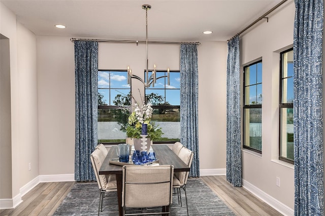 13722 Heartwood Way, Parrish, FL 34219 - dining area with wood finished floors, baseboards, and recessed lighting