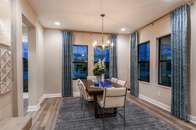 13722 Heartwood Way, Parrish, FL 34219 - dining space featuring wood finished floors, a chandelier, recessed lighting, and baseboards